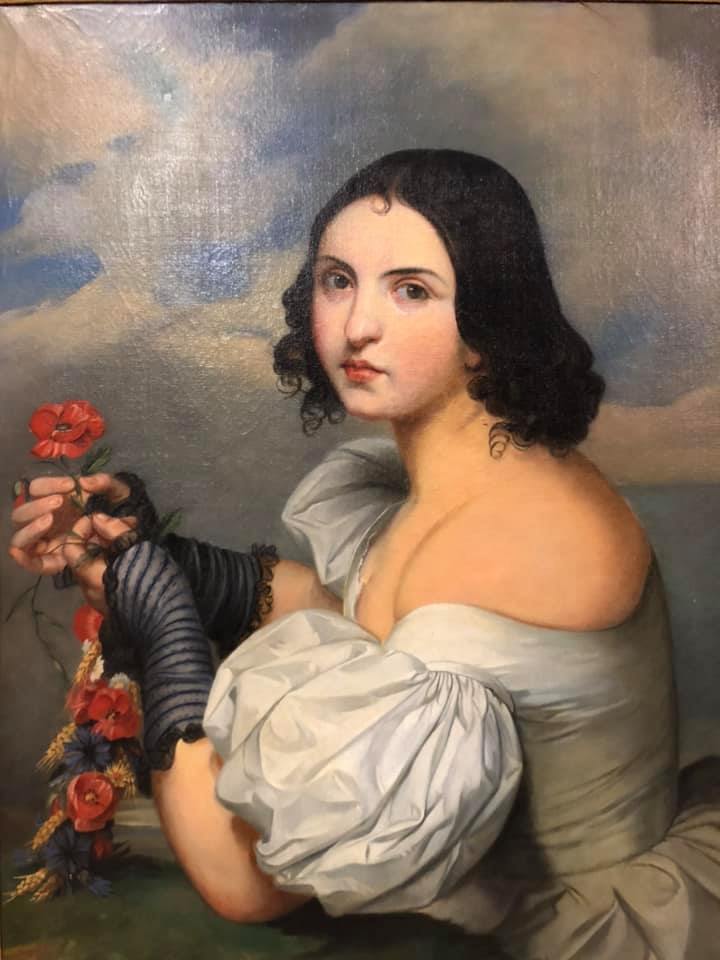 Tableau représentant une femme avec des fleurs