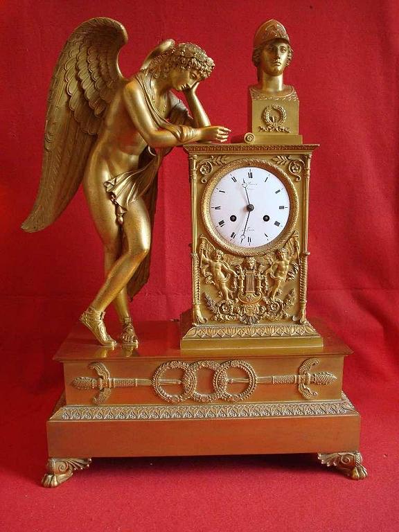 Pendule Empire bronze doré (adjugée 5 400€)