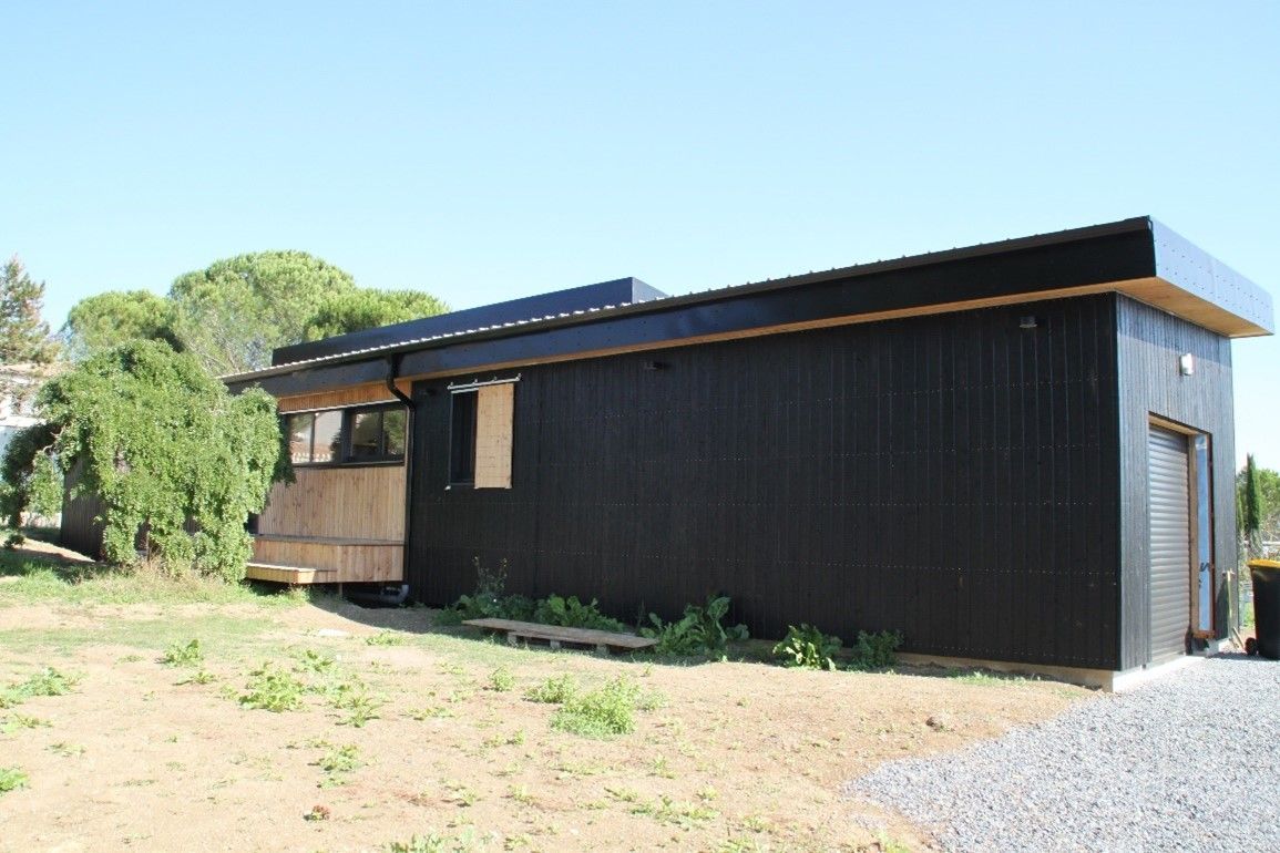Maison à ossature bois et toiture en bac acier