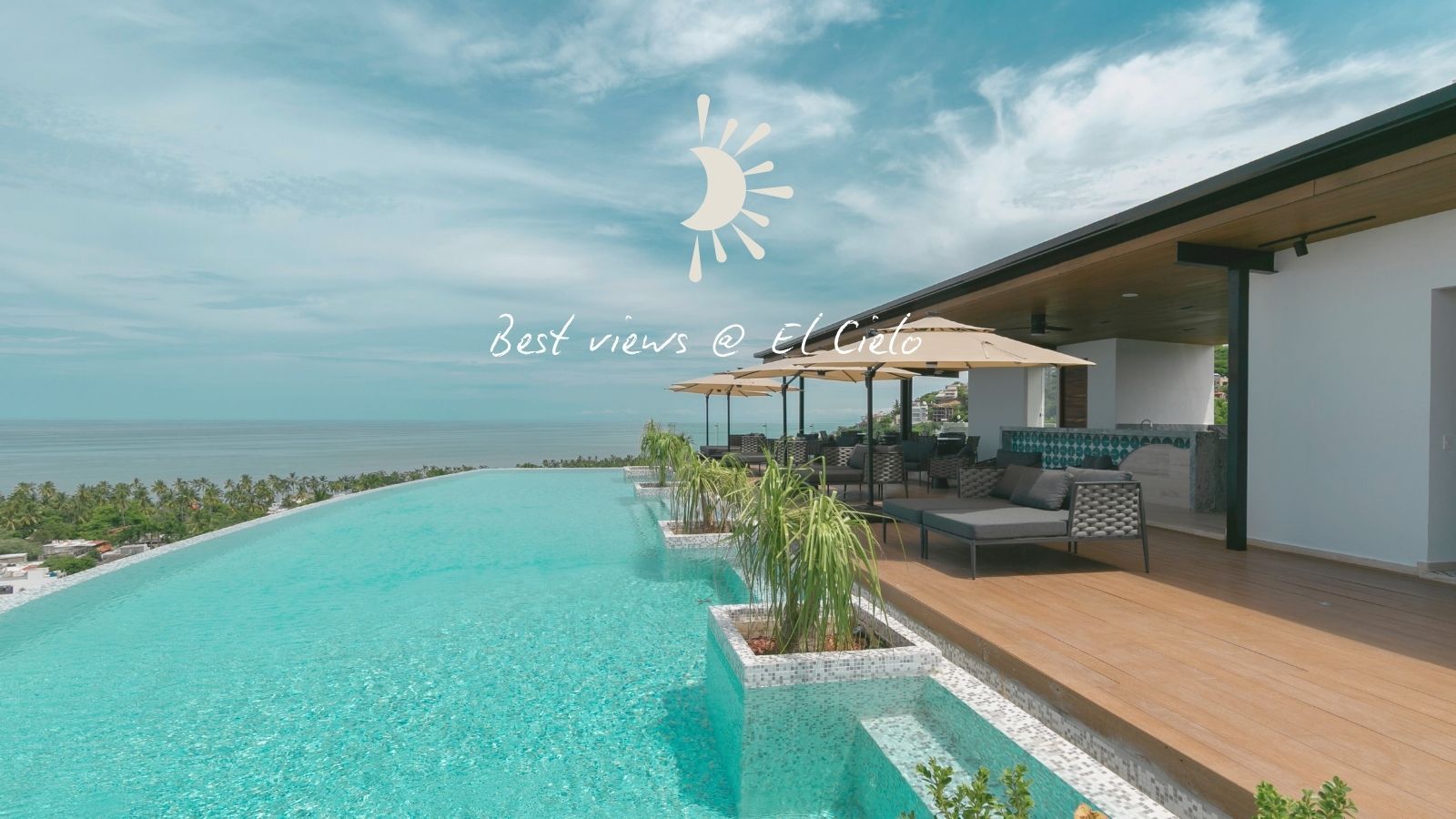 Infinity pool overlooking the ocean, with lounge seating and a partially covered deck.