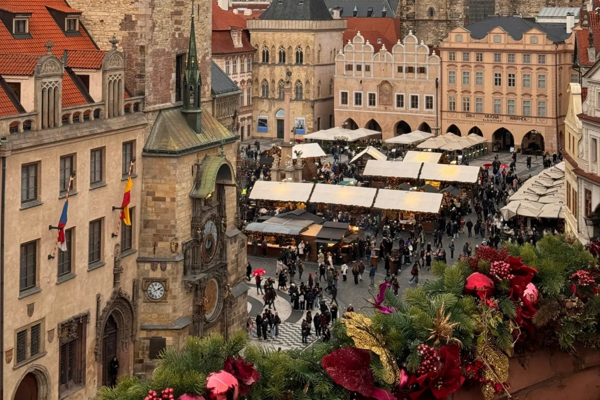 Town square with many people, shops, and buildings; Prague, Czech Republic.