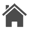 Un icono en blanco y negro de una casa con chimenea sobre un fondo blanco.