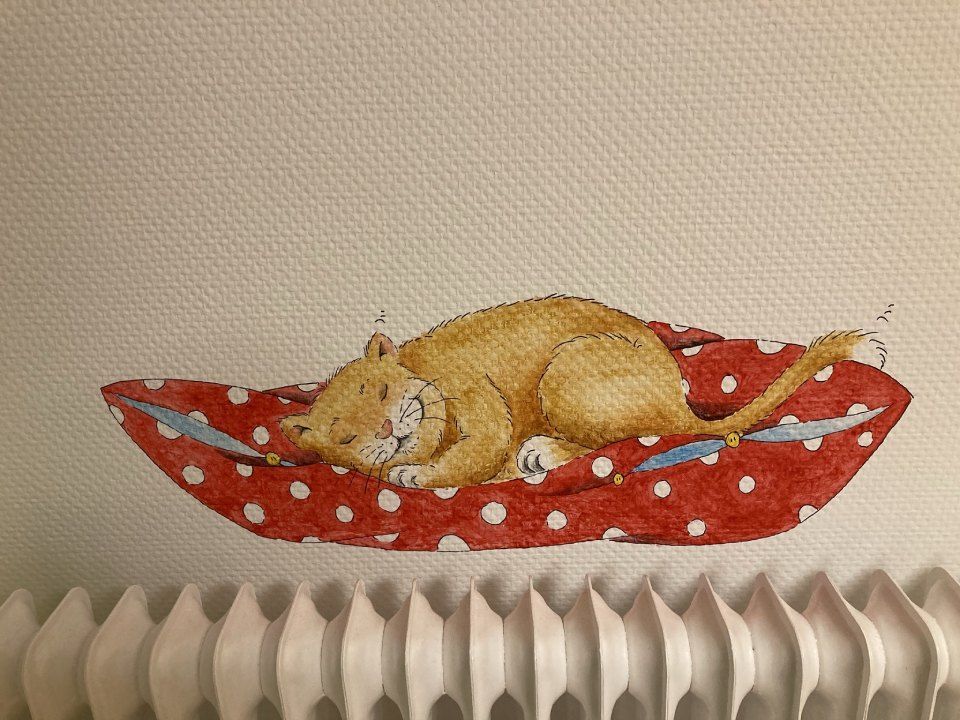 Katze auf einer Tapete in der Kinderarztpraxis Börchers