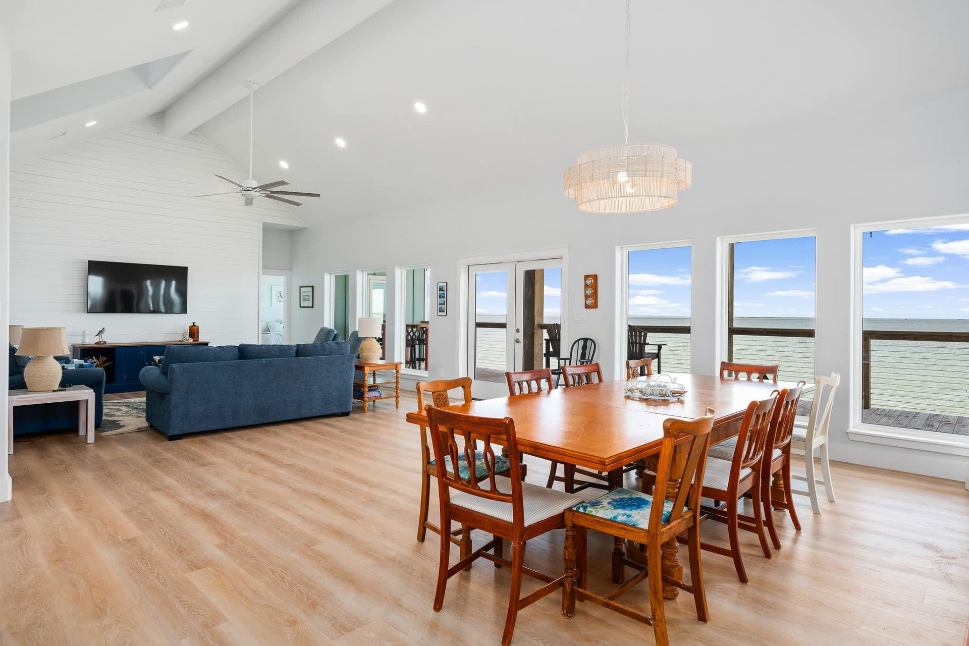 Large dining space overlooking the water in a luxury short-term rental