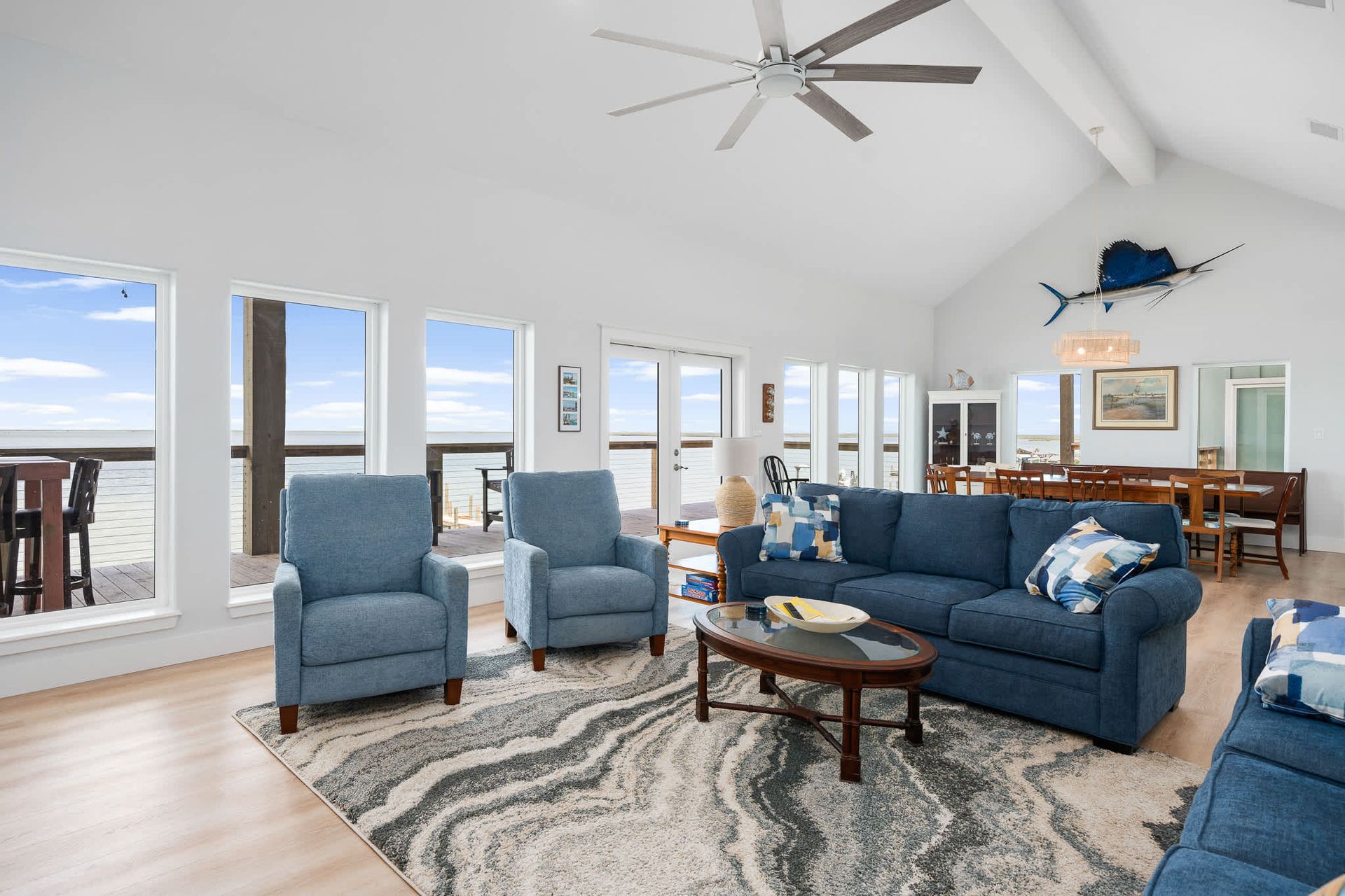  Open-concept living room with panoramic ocean views in a short-term rental home