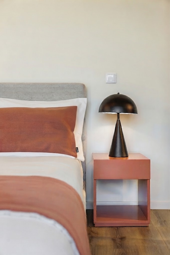 Beautifully styled luxury bedroom with warm ambient lighting