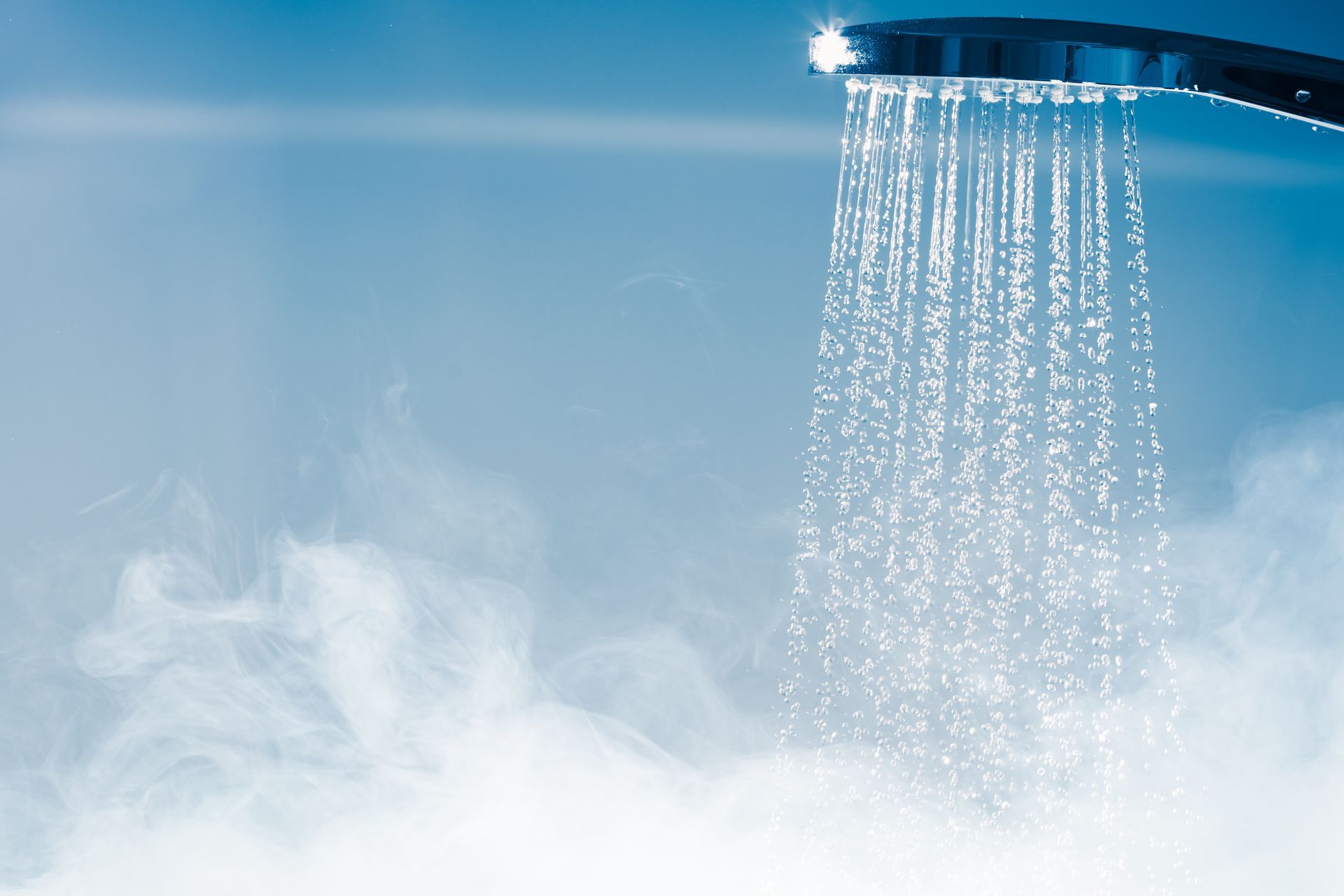 Pommeau douche allumé avec l'eau qui coule