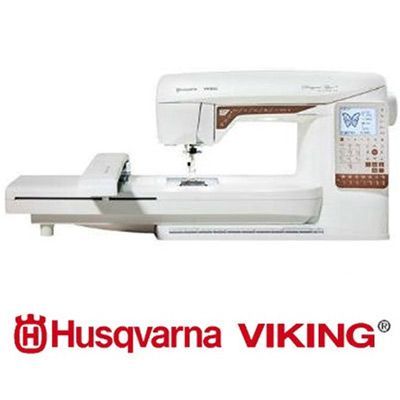 Machine à coudre Husqvarna VIKING, blanche et bronze, avec fonctions de broderie et logo de la marque.