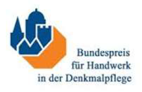 Logo with blue, yellow, and red shield icons above the text 