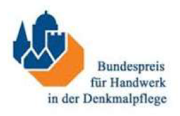 Logo with blue, yellow, and red shield icons above the text 