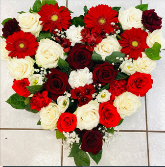 Photo de fleurs de deuil rouges et blanches