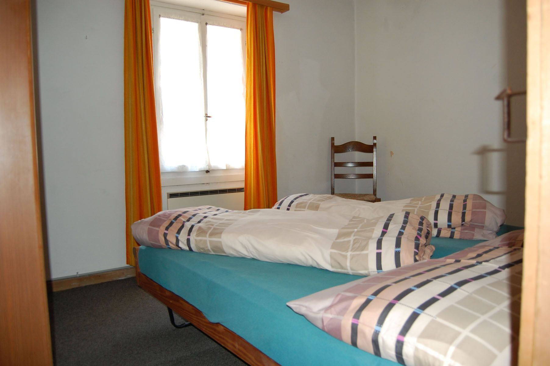 Letto matrimoniale con piumone - Panetteria Pasticceria Ostello Alpina