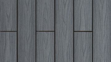 Un primer plano de un piso de madera gris con una textura sin costuras.