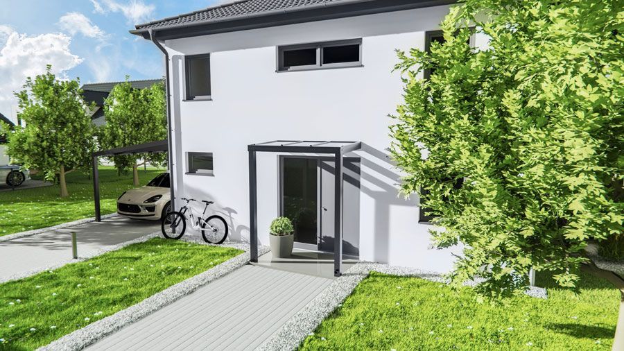 Ein weißes Haus mit einem davor geparkten Auto.