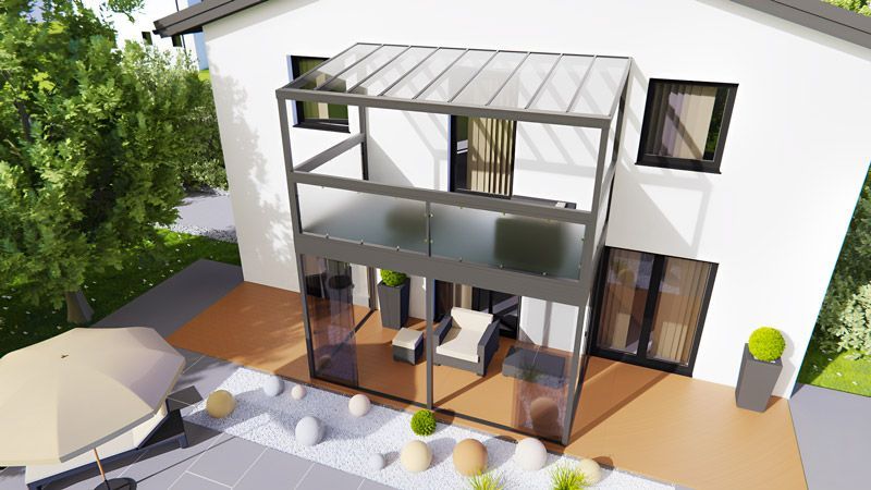 Eine Luftaufnahme eines Hauses mit Balkon und Terrasse.