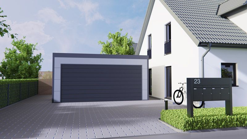 Ein weißes Haus mit einem schwarzen Garagentor und einem davor geparkten Fahrrad.