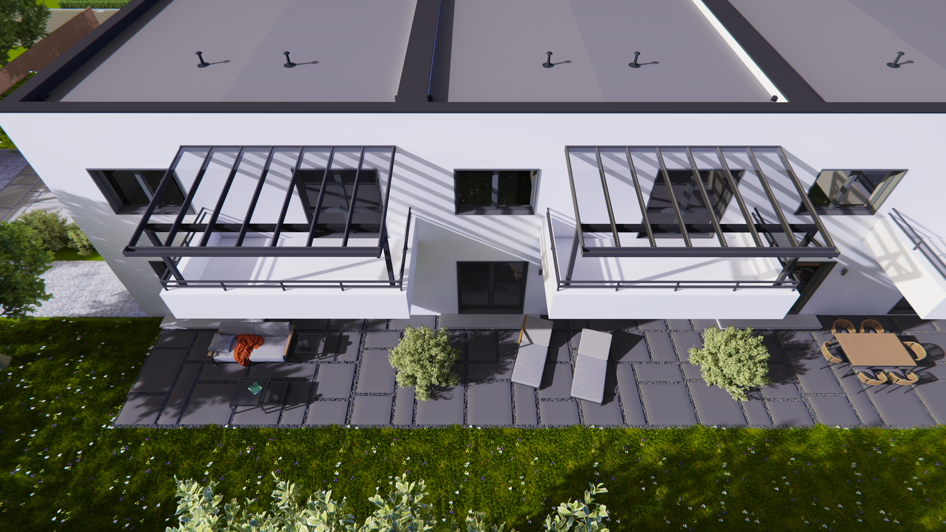 Eine Luftaufnahme eines Hauses mit Terrasse und Balkonen