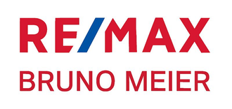 RE/MAX Uster-Logo mit rotem Text und blauem Streifen.