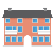 Edificio de apartamentos con fachada de color rojo anaranjado, techo gris oscuro, ventanas azules y entrada arqueada.