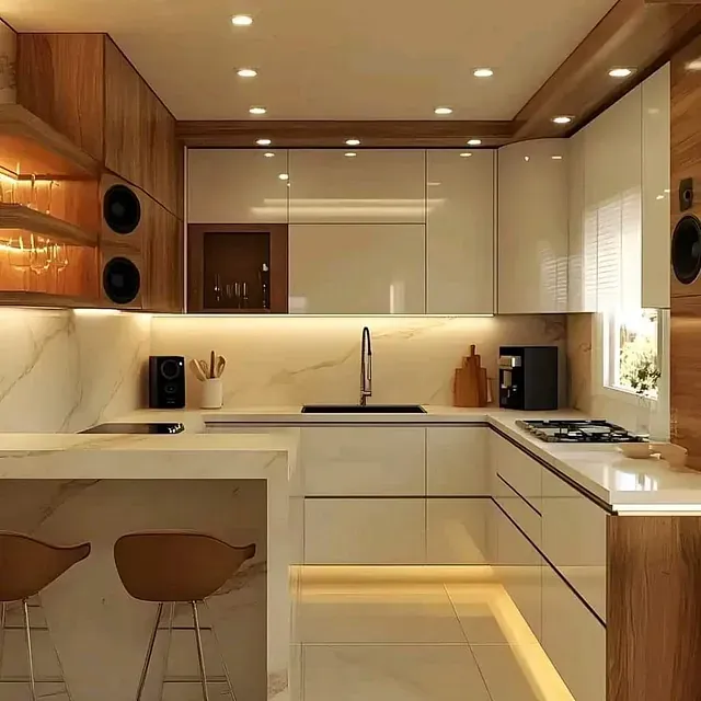 Una cocina con muebles blancos, gabinetes de madera, un fregadero y una barra.