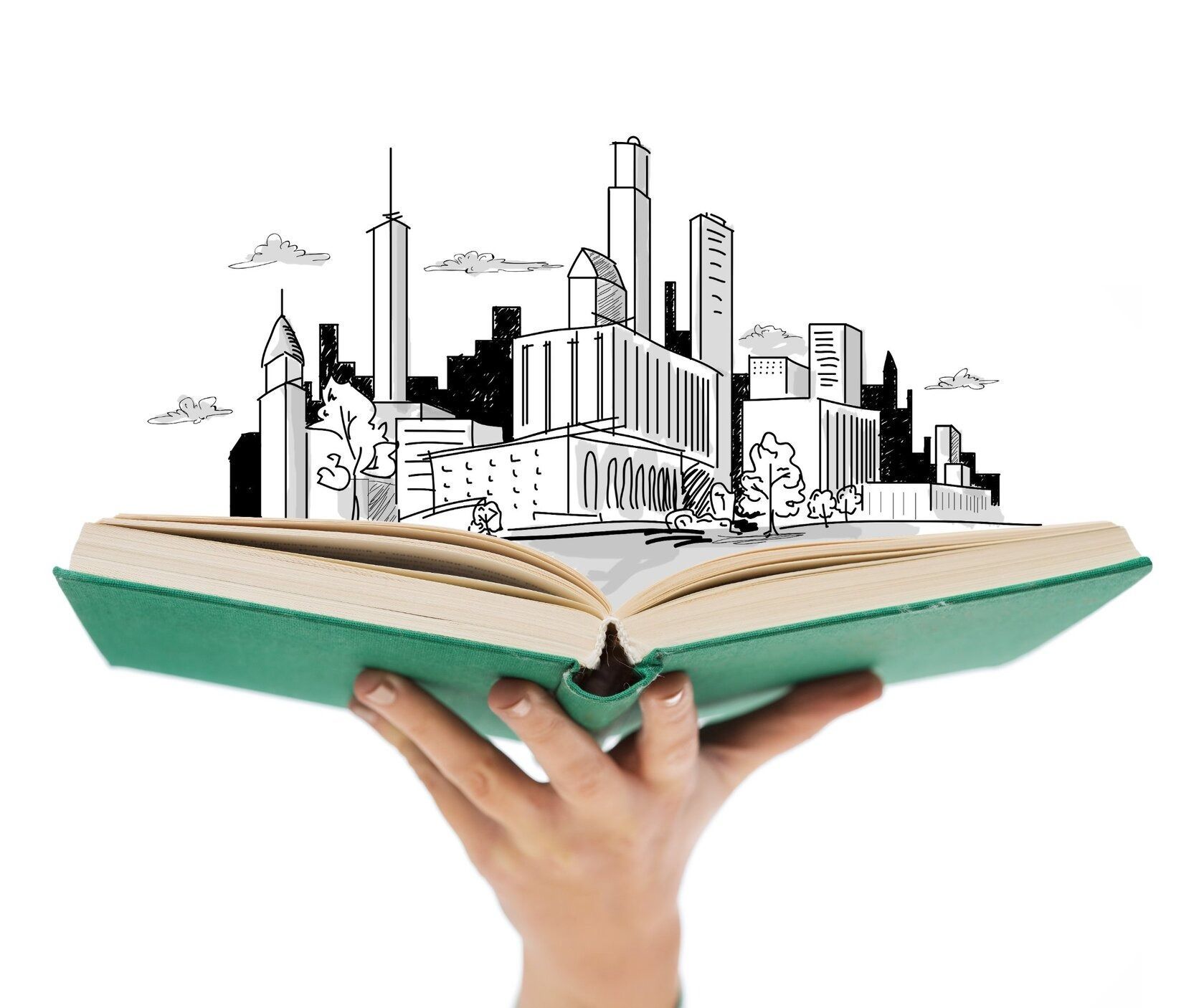 Una mano sostiene un libro abierto con una ciudad dibujada en él.