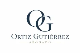 Logotipo de abogado Ortiz Gutiérrez con letras azul marino entrelazadas sobre fondo blanco