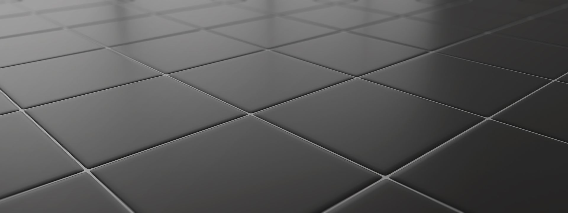 Gros plan sur une surface noire brillante et matelassée avec des surpiqûres en losange.