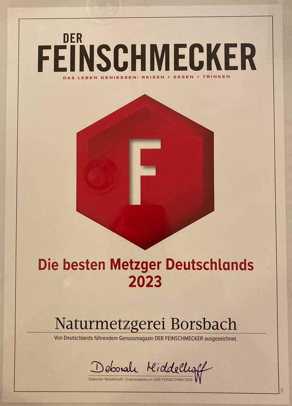 Ein Schild mit der Aufschrift „Der Feinschmecker“