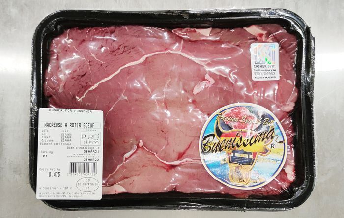 Una bandeja de carne cruda con una etiqueta que dice bonanza