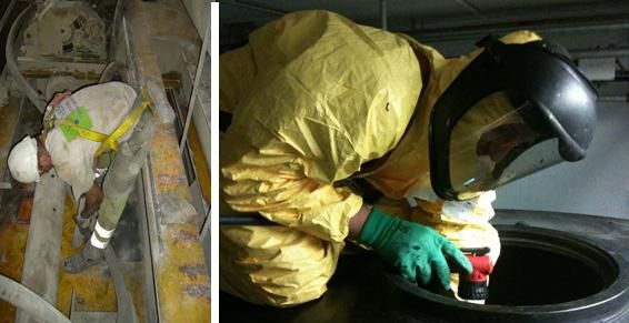 Deux ouvriers en tenue de protection ; l’un dans un espace confiné, l’autre près d’une grande cuve. On distingue des combinaisons et des casques jaunes.