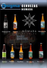 Varias botellas de cerveza están en un cartel que dice cervezas nómada
