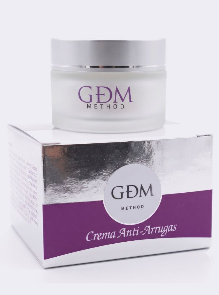Tarro de crema antiedad GDM Método en caja plateada y morada.