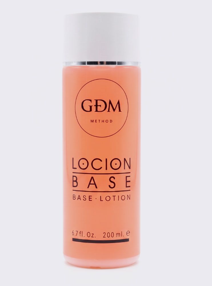 Frasco de loción color melocotón con tapa blanca, etiquetado como “GDM” y “LOCION BASE”, 200 ml.