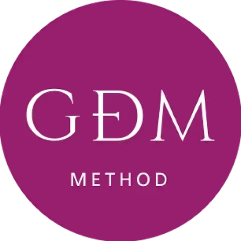 Un logotipo para el método gdm en un círculo morado.