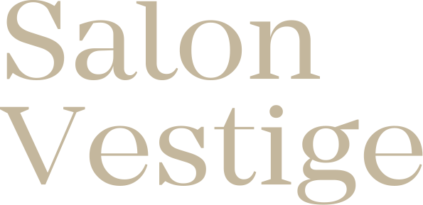 Un logotipo para un salón llamado salón vestigio sobre un fondo blanco.