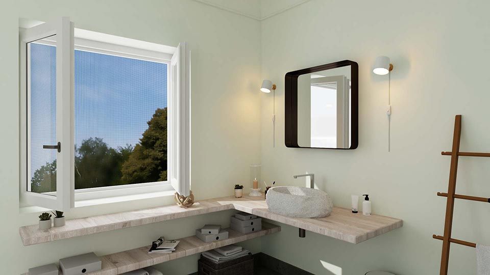Salle de bain avec fenêtre ouverte, comptoir en bois et miroir décoratif.