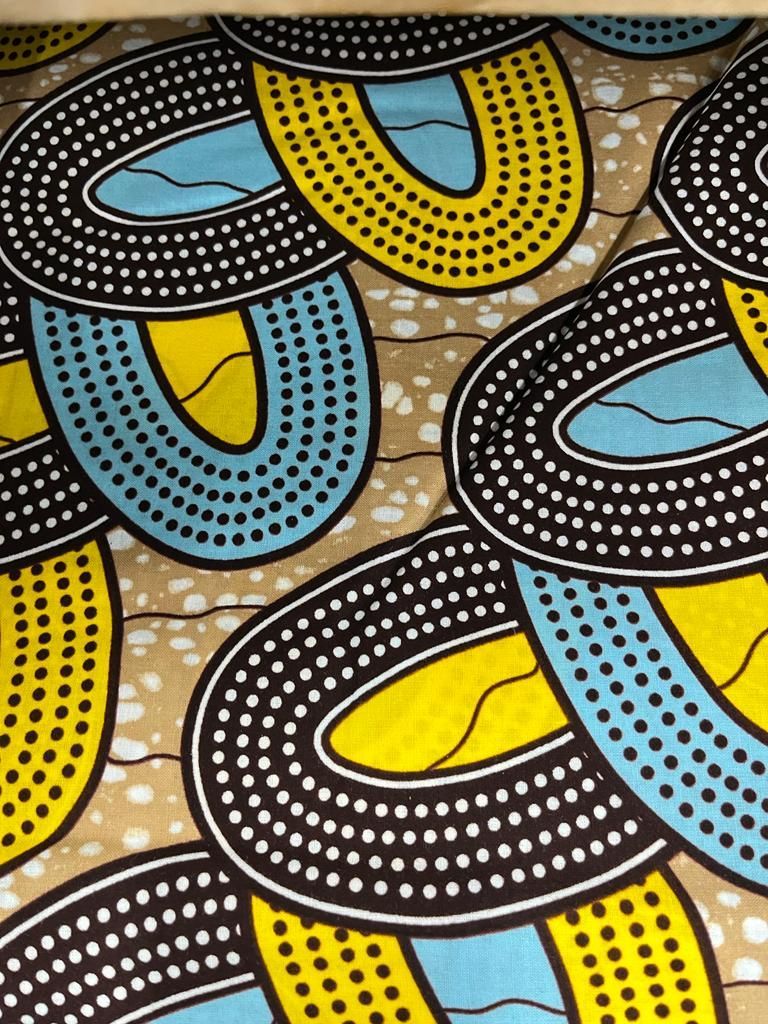 Tissu motif ovale jaune, noir et bleu