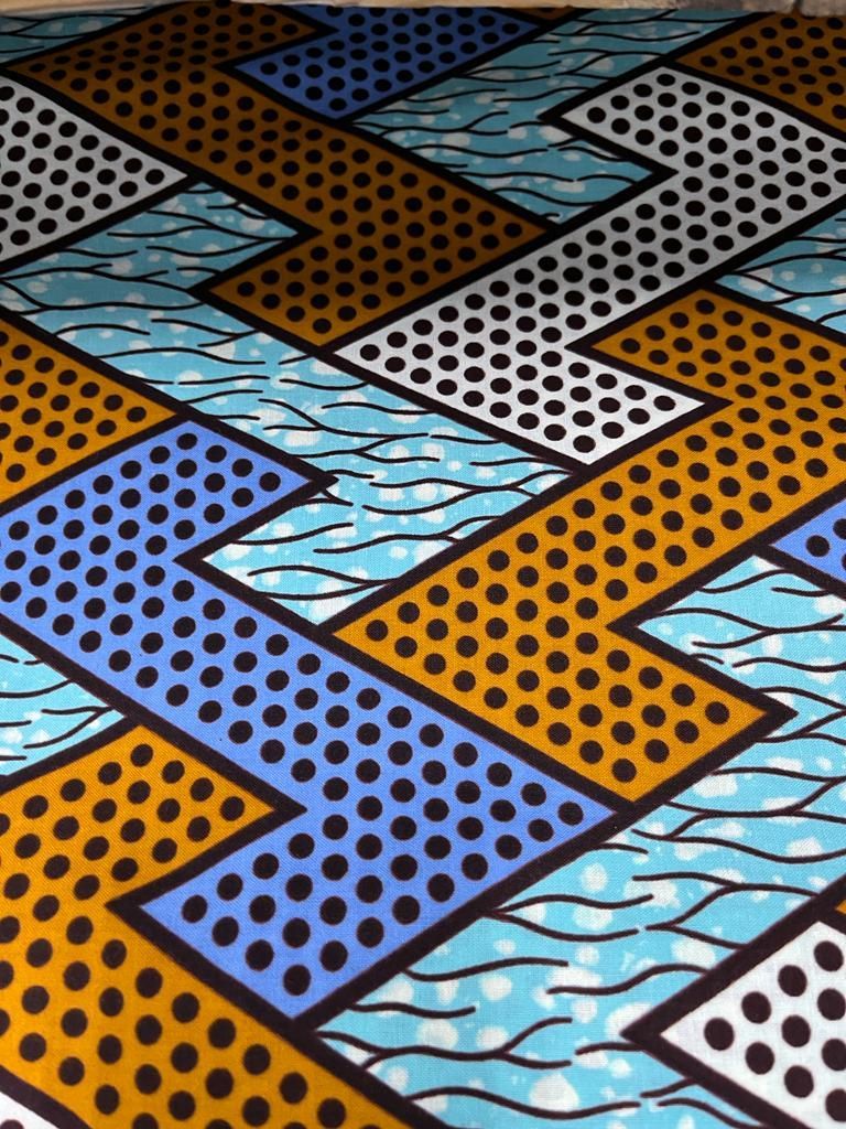 Tissu motif zig-zag blanc, bleu et orange