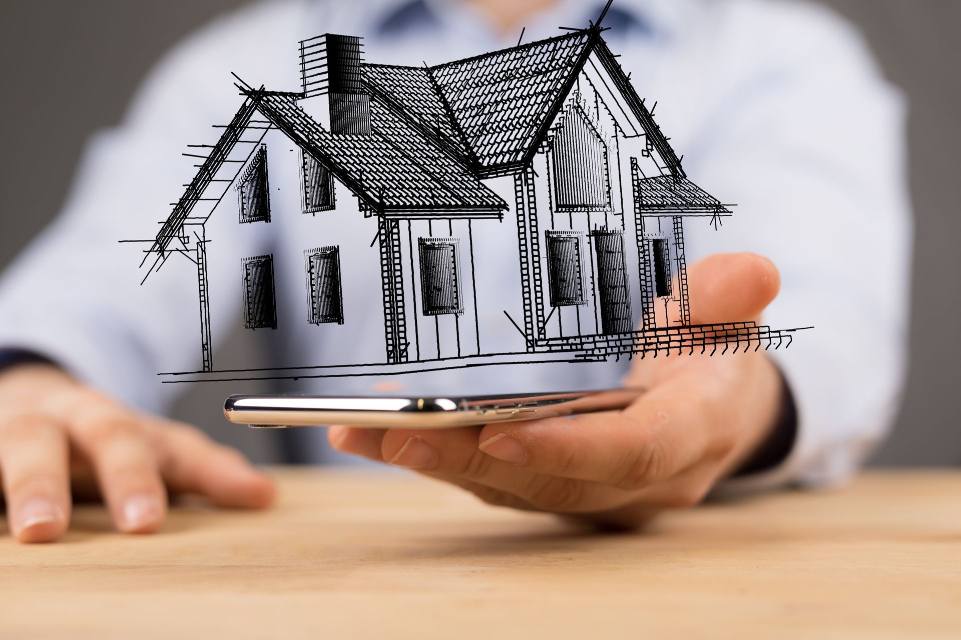 Une main portant une maison pour des assurances de crédit