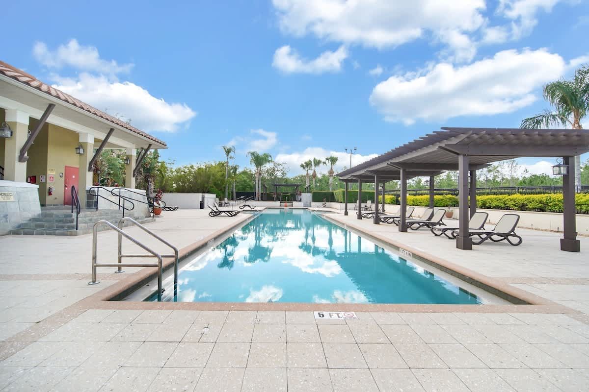 A large swimming pool with a staircase leading to it