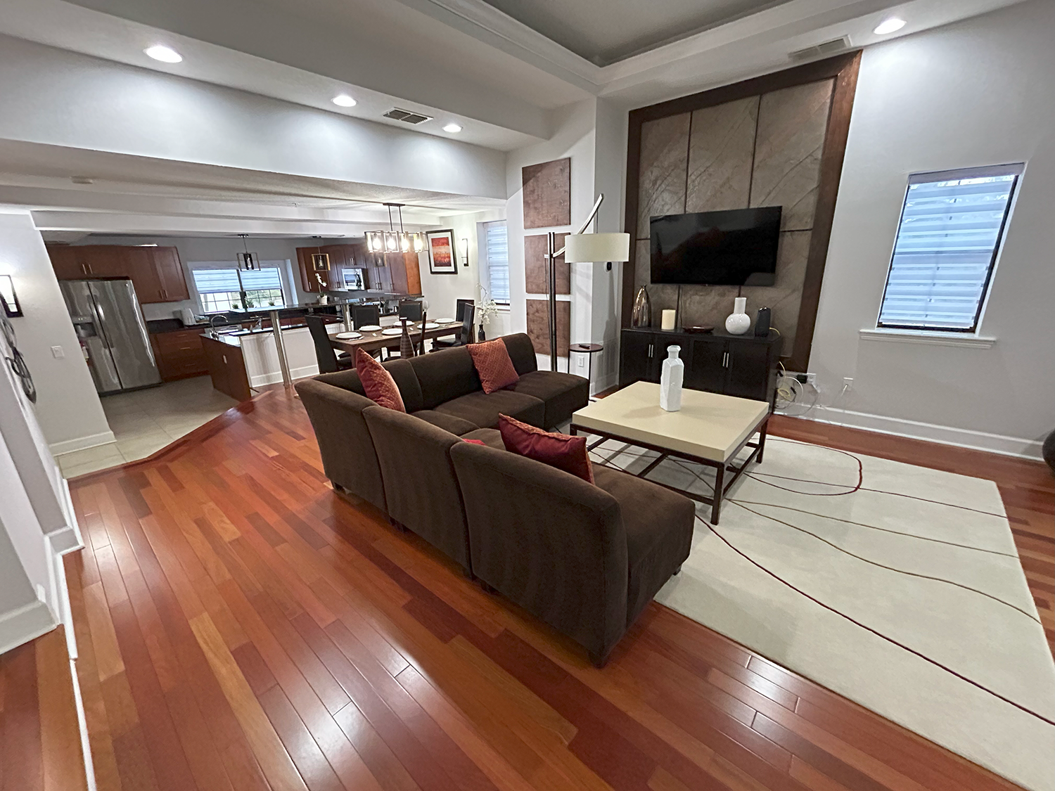 A living room filled with furniture and a flat screen tv.