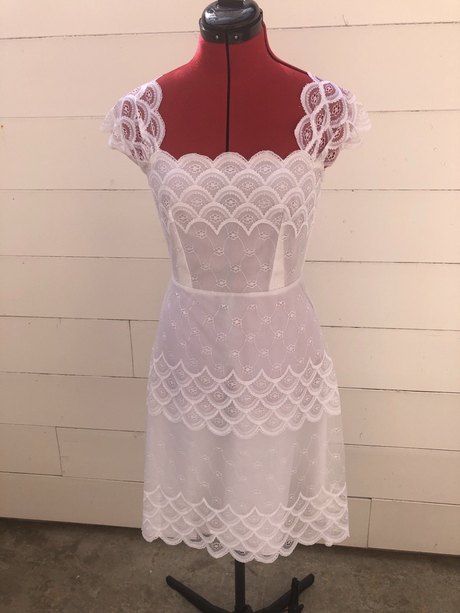 Robe de marièe avec dentelle en retouche