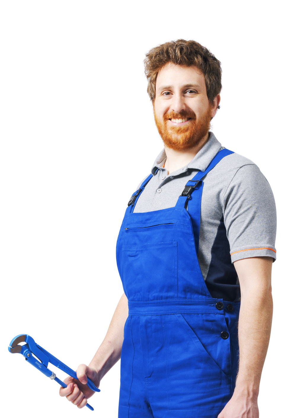 Plombier en salopette bleue souriant, tenant une clé à pipe bleue.
