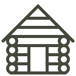 A black and white icon of a log cabin.