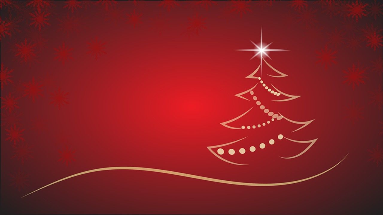 Un albero di Natale con una stella in cima su uno sfondo rosso
