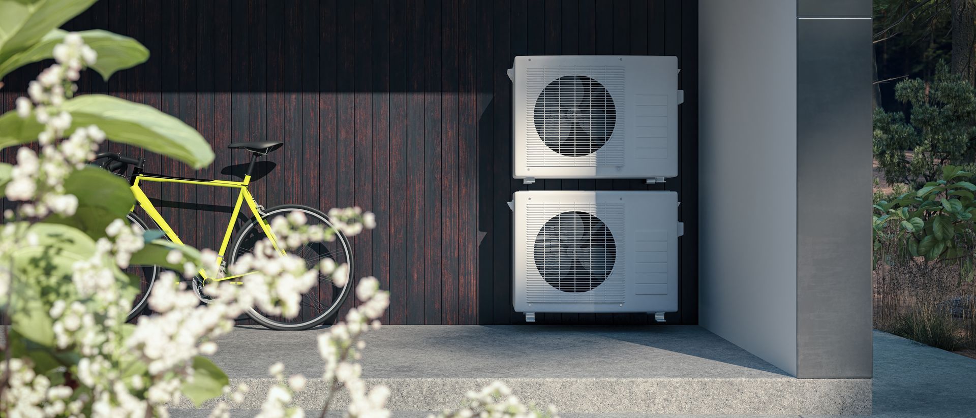 Unités de climatisation extérieures contre un mur.