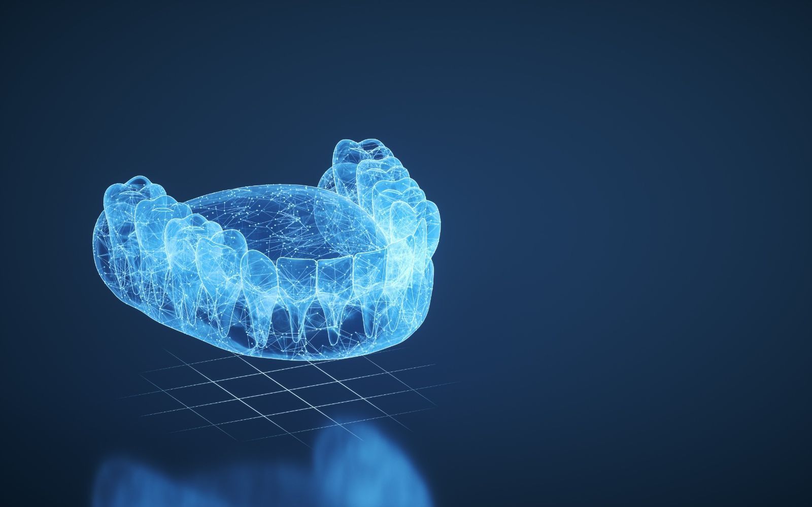 Una representación 3D de un aparato dental sobre una superficie azul.