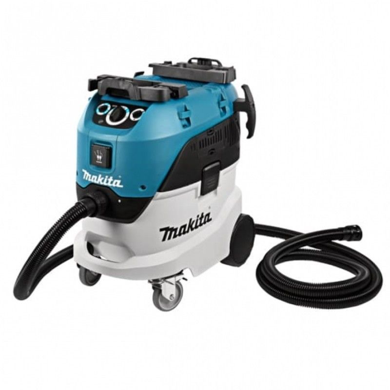 Un aspirapolvere Makita blu e bianco con ruote