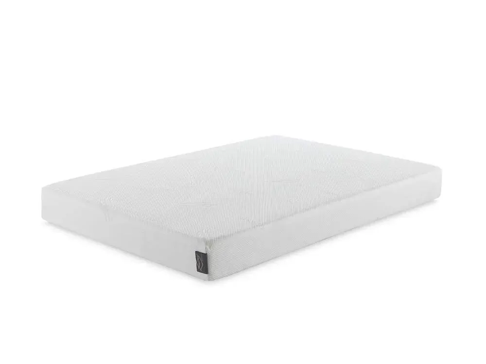 Un colchón blanco está sobre una superficie blanca.