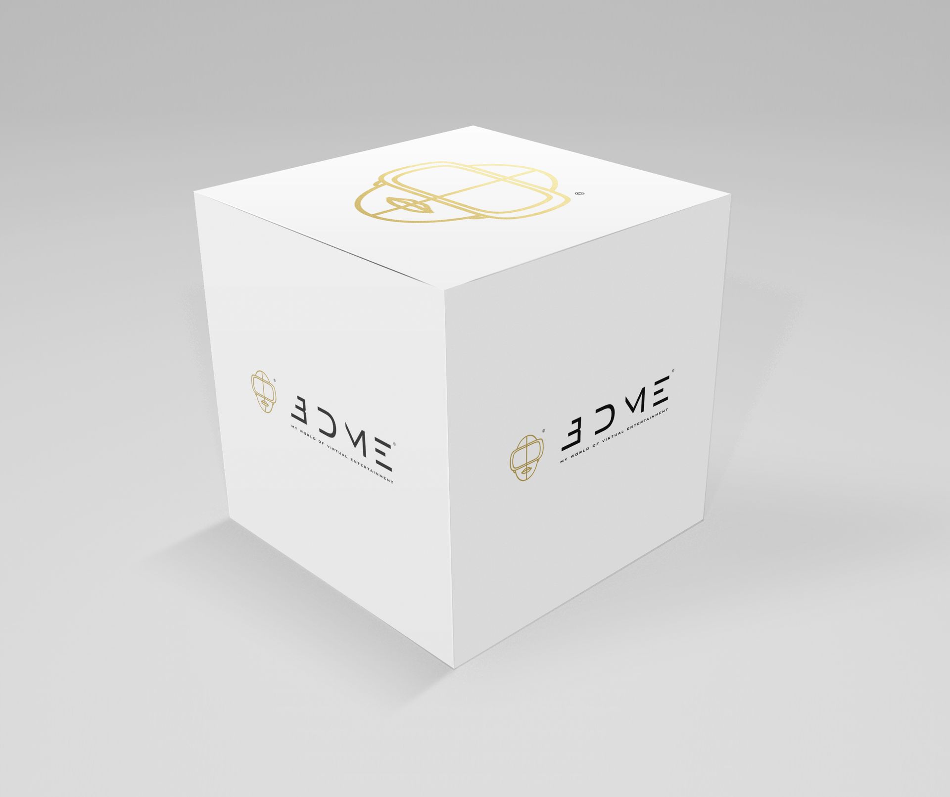 A white cube on a gray background, featuring gold 
